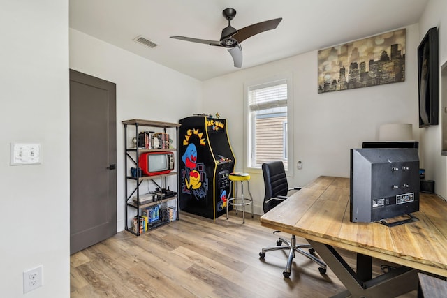 office space featuring wood finished floors and ceiling fan