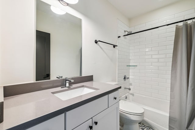 bathroom with toilet, shower / bath combo, and vanity