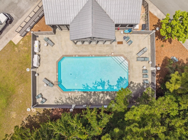 view of subject property with a pool area