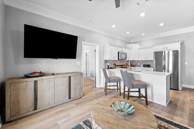 4724 Rendezvous Cv, Destin, FL 32541 - living room featuring crown molding, recessed lighting, light wood finished floors, baseboards, and ceiling fan
