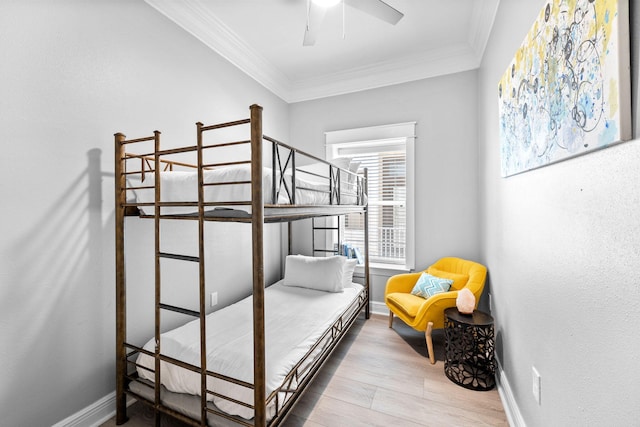 4724 Rendezvous Cv, Destin, FL 32541 - bedroom with crown molding, wood finished floors, baseboards, and ceiling fan