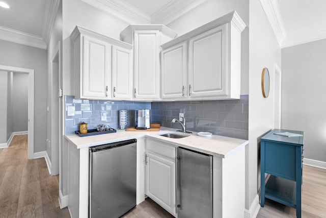 4724 Rendezvous Cv, Destin, FL 32541 - kitchen with fridge, a sink, baseboards, backsplash, and crown molding