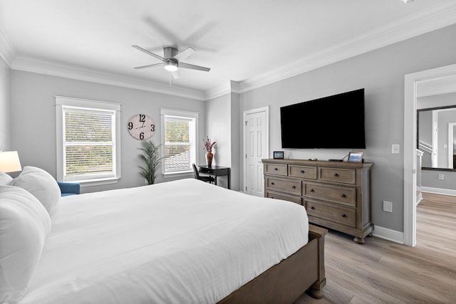 4724 Rendezvous Cv, Destin, FL 32541 - bedroom with light wood finished floors, crown molding, baseboards, and ceiling fan