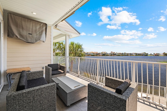 4724 Rendezvous Cv, Destin, FL 32541 - view of patio with a water view, a balcony, and an outdoor living space