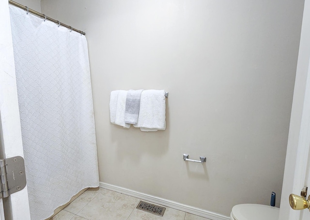 1100 Crosswinds Lndg Unit 21, Fort Walton Beach, FL 32547 - bathroom featuring baseboards, tile patterned flooring, and toilet