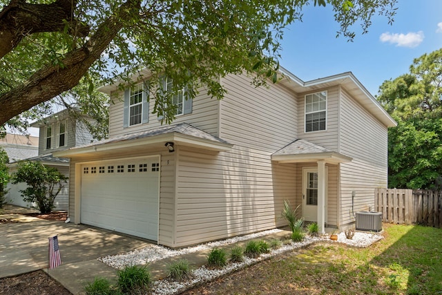 9 5th Ave, Shalimar, FL 32579 - traditional-style home with a garage, driveway, and cooling unit