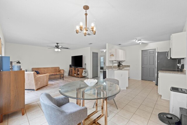 9 5th Ave, Shalimar, FL 32579 - dining room featuring a chandelier, light tile patterned flooring, and a ceiling fan