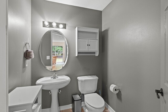 9 5th Ave, Shalimar, FL 32579 - bathroom featuring toilet and baseboards