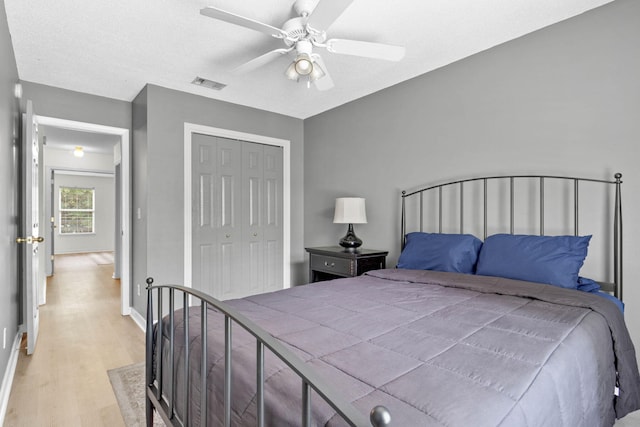 9 5th Ave, Shalimar, FL 32579 - bedroom with light wood finished floors, a closet, baseboards, and a ceiling fan
