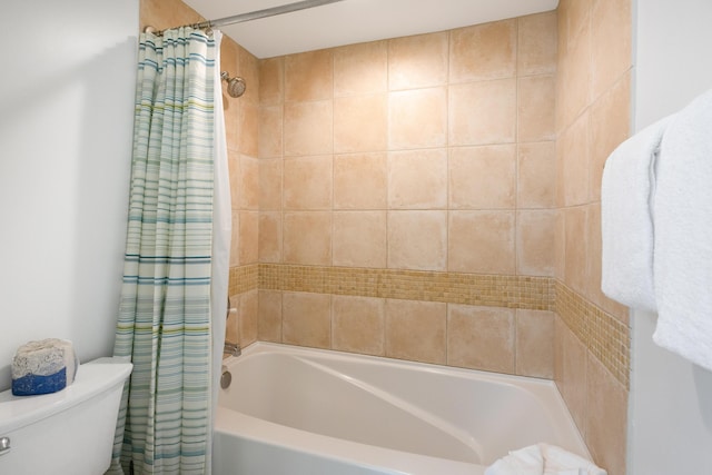 full bathroom with toilet and shower / bath combo