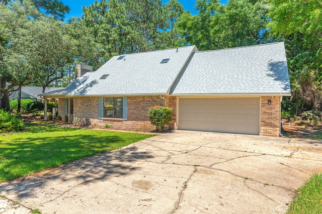 829 S Turnberry Cv, Niceville, FL 32578 - view of front of property featuring a garage, brick siding, concrete driveway, and a chimney