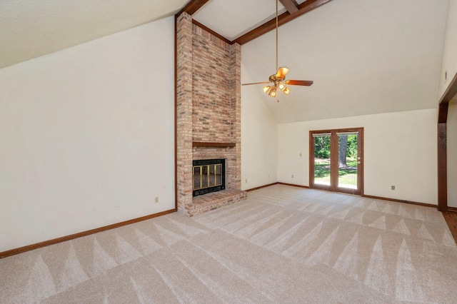 829 S Turnberry Cv, Niceville, FL 32578 - unfurnished living room featuring ceiling fan, carpet floors, high vaulted ceiling, a fireplace, and beamed ceiling