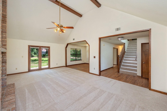 829 S Turnberry Cv, Niceville, FL 32578 - unfurnished living room with carpet, high vaulted ceiling, baseboards, ceiling fan, and beam ceiling