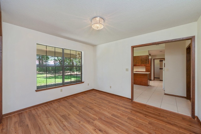 829 S Turnberry Cv, Niceville, FL 32578 - empty room featuring light wood-style floors and baseboards