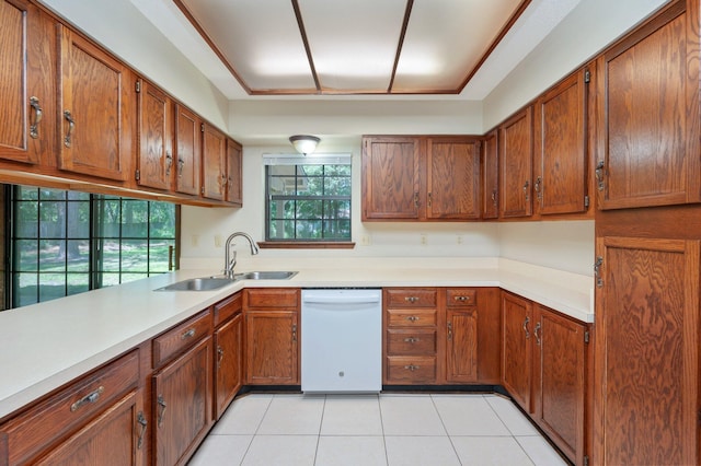 829 S Turnberry Cv, Niceville, FL 32578 - kitchen featuring white dishwasher, a sink, brown cabinets, and light countertops