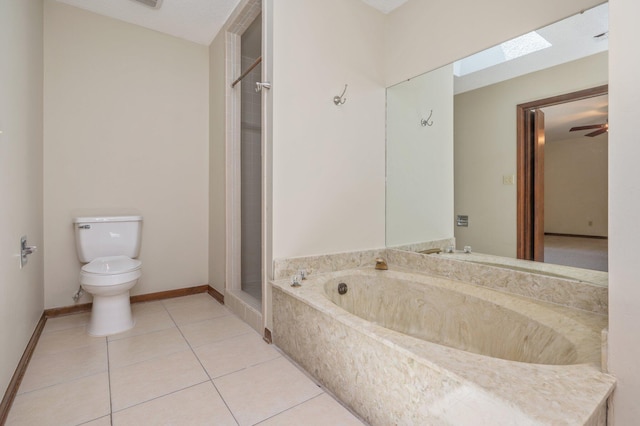 829 S Turnberry Cv, Niceville, FL 32578 - full bath with toilet, tile patterned flooring, a skylight, a stall shower, and a garden tub