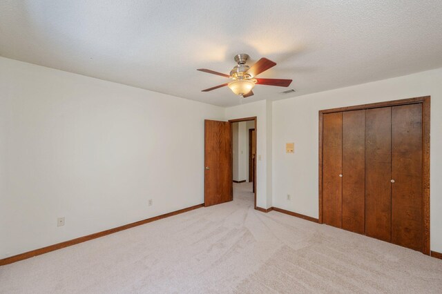 829 S Turnberry Cv, Niceville, FL 32578 - unfurnished bedroom with light colored carpet, a closet, baseboards, and ceiling fan