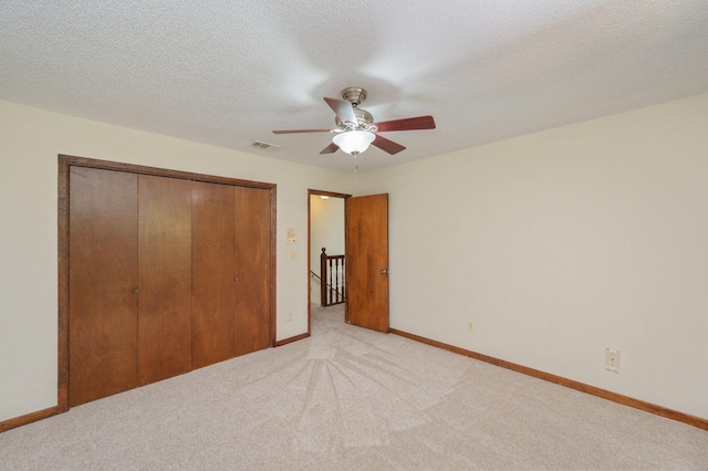 829 S Turnberry Cv, Niceville, FL 32578 - unfurnished bedroom featuring light colored carpet, a closet, baseboards, and ceiling fan