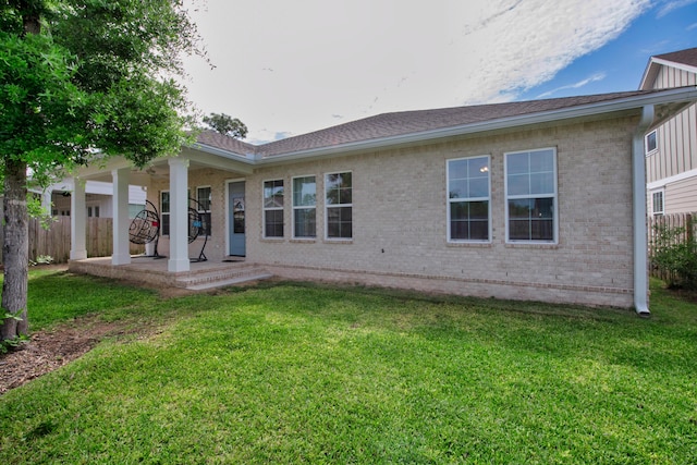 1233 Elderflower Dr, Niceville, FL 32578 - rear view of house with brick siding and roof with shingles