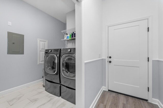 1233 Elderflower Dr, Niceville, FL 32578 - clothes washing area with electric panel, washer and dryer, and baseboards