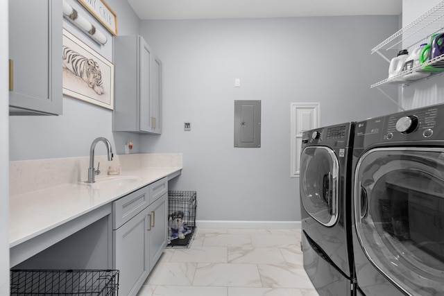1233 Elderflower Dr, Niceville, FL 32578 - washroom with washer and clothes dryer, cabinet space, electric panel, light marble finish floors, and baseboards