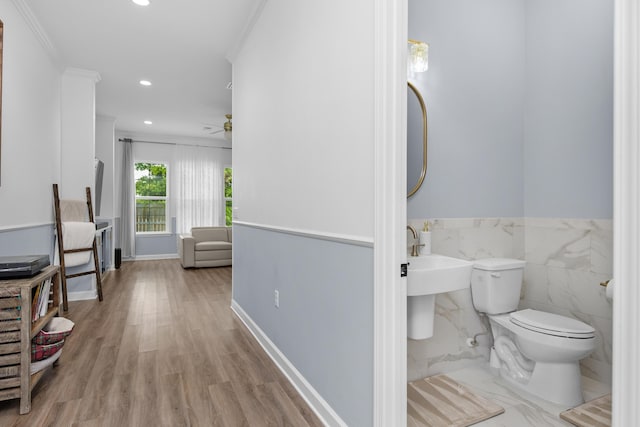 1233 Elderflower Dr, Niceville, FL 32578 - bathroom with toilet, ornamental molding, recessed lighting, ceiling fan, and wood finished floors