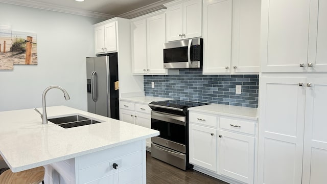 9 Inlet Heights Ln, Inlet Beach, FL 32461 - kitchen with appliances with stainless steel finishes, a sink, decorative backsplash, a center island with sink, and white cabinetry