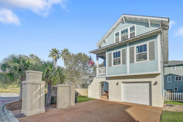 9 Inlet Heights Ln, Inlet Beach, FL 32461 - view of front of property with fence, an attached garage, and decorative driveway