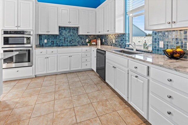 1280 Mahogany Mill Rd, Pensacola, FL 32507 - kitchen with black appliances, tasteful backsplash, a sink, and white cabinets
