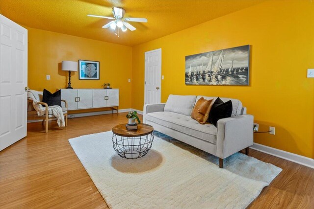 1280 Mahogany Mill Rd, Pensacola, FL 32507 - living room featuring wood finished floors, ceiling fan, and baseboards