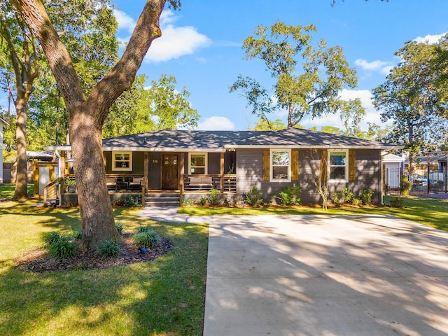 236 Little Canal Dr, Santa Rosa Beach, FL 32459 - view of front of property with covered porch, a front lawn, and driveway