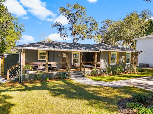 236 Little Canal Dr, Santa Rosa Beach, FL 32459 - view of front facade featuring a porch and a front lawn