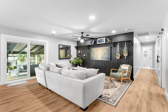 236 Little Canal Dr, Santa Rosa Beach, FL 32459 - living room with a barn door, recessed lighting, a ceiling fan, and wood finished floors