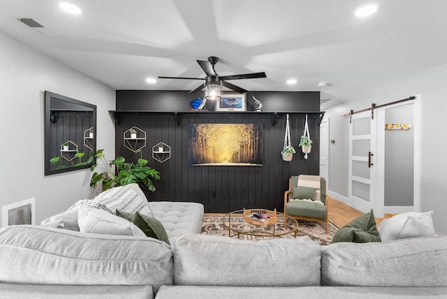 236 Little Canal Dr, Santa Rosa Beach, FL 32459 - living room with a barn door, recessed lighting, ceiling fan, and wood finished floors