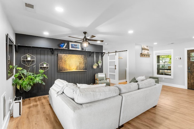236 Little Canal Dr, Santa Rosa Beach, FL 32459 - living area with a barn door, wood finished floors, ceiling fan, and recessed lighting