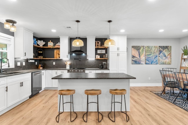 236 Little Canal Dr, Santa Rosa Beach, FL 32459 - kitchen with open shelves, appliances with stainless steel finishes, wall chimney range hood, light wood finished floors, and recessed lighting