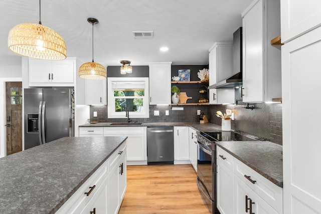 236 Little Canal Dr, Santa Rosa Beach, FL 32459 - kitchen featuring stainless steel appliances, wall chimney exhaust hood, open shelves, backsplash, and recessed lighting