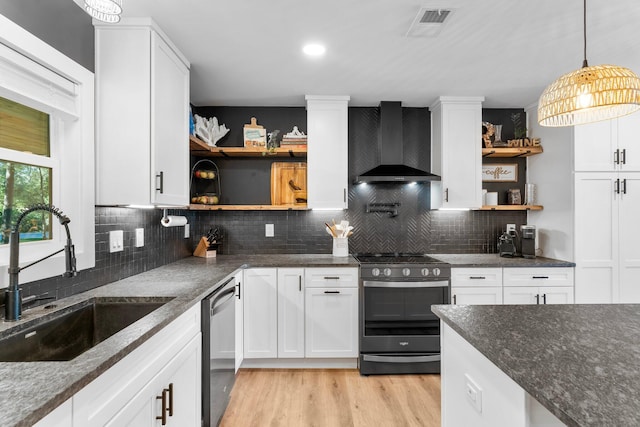236 Little Canal Dr, Santa Rosa Beach, FL 32459 - kitchen with wall chimney range hood, stainless steel appliances, open shelves, and white cabinetry