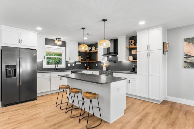 236 Little Canal Dr, Santa Rosa Beach, FL 32459 - kitchen with stainless steel appliances, open shelves, wall chimney range hood, dark countertops, and recessed lighting