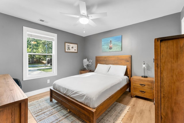 236 Little Canal Dr, Santa Rosa Beach, FL 32459 - bedroom with light wood-style floors and ceiling fan