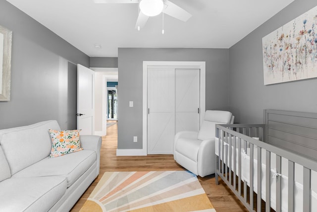236 Little Canal Dr, Santa Rosa Beach, FL 32459 - bedroom with wood finished floors, a closet, ceiling fan, and a nursery area