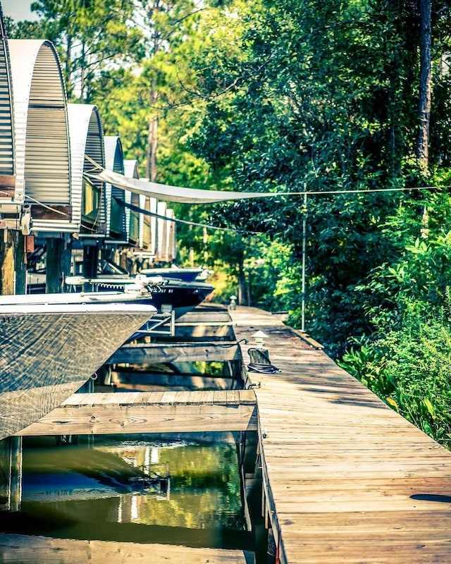 236 Little Canal Dr, Santa Rosa Beach, FL 32459 - wooden deck with a dock