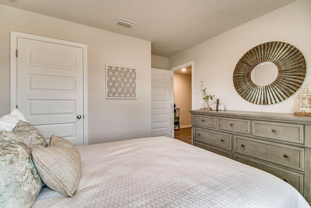 bedroom with wood finished floors