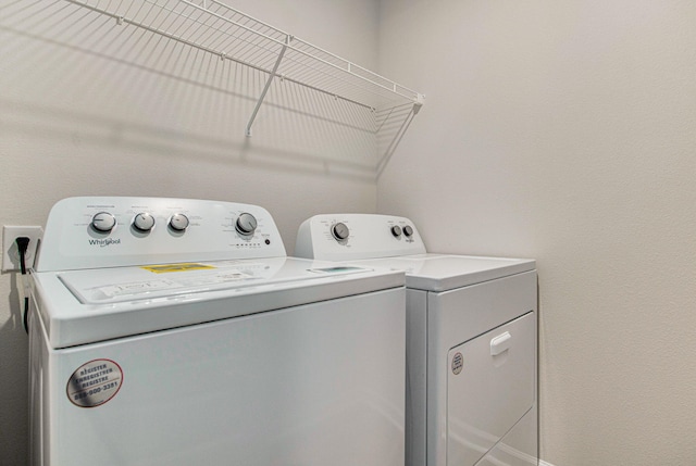 washroom with washer and clothes dryer