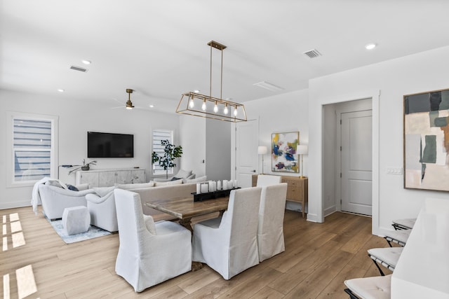 dining room featuring light wood-style flooring, ceiling fan, and recessed lighting