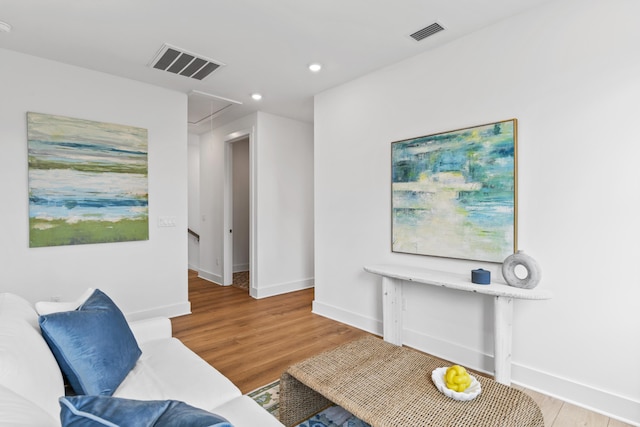 sitting room with attic access, wood finished floors, recessed lighting, and baseboards