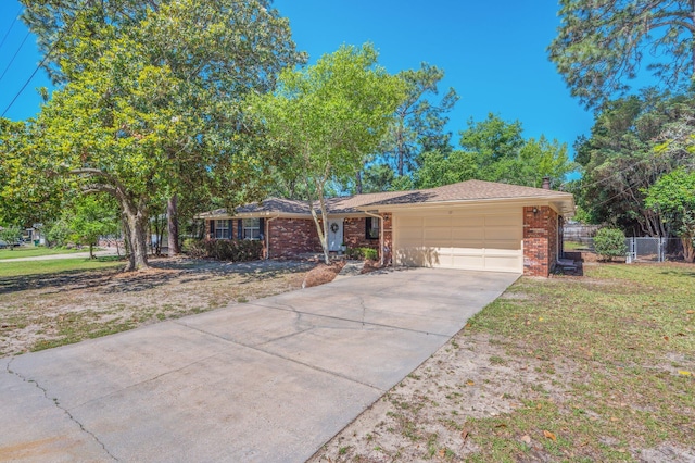 37 James Dr, Shalimar, FL 32579 - single story home with an attached garage, driveway, and brick siding