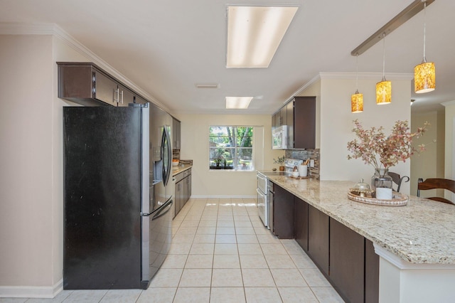 37 James Dr, Shalimar, FL 32579 - kitchen featuring stainless steel appliances, dark brown cabinetry, a peninsula, light tile patterned floors, and baseboards