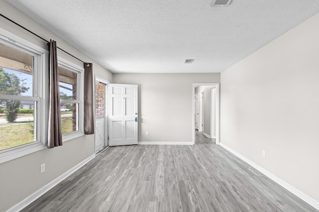 4360 Beau Terra Ln, Pensacola, FL 32514 - unfurnished room featuring a textured ceiling, wood finished floors, and baseboards