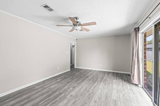 4360 Beau Terra Ln, Pensacola, FL 32514 - spare room with wood finished floors, a textured ceiling, a ceiling fan, crown molding, and baseboards